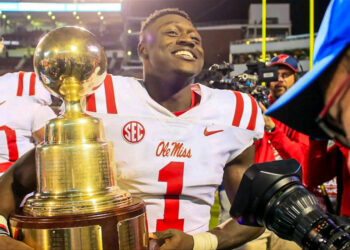 A.J. Brown holding the Egg Bowl Trophy
